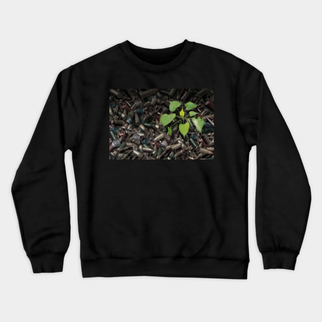 Gun Violence Hope Concept as gun shells with a green sapling growing as inspirational surreal art Crewneck Sweatshirt by lightidea